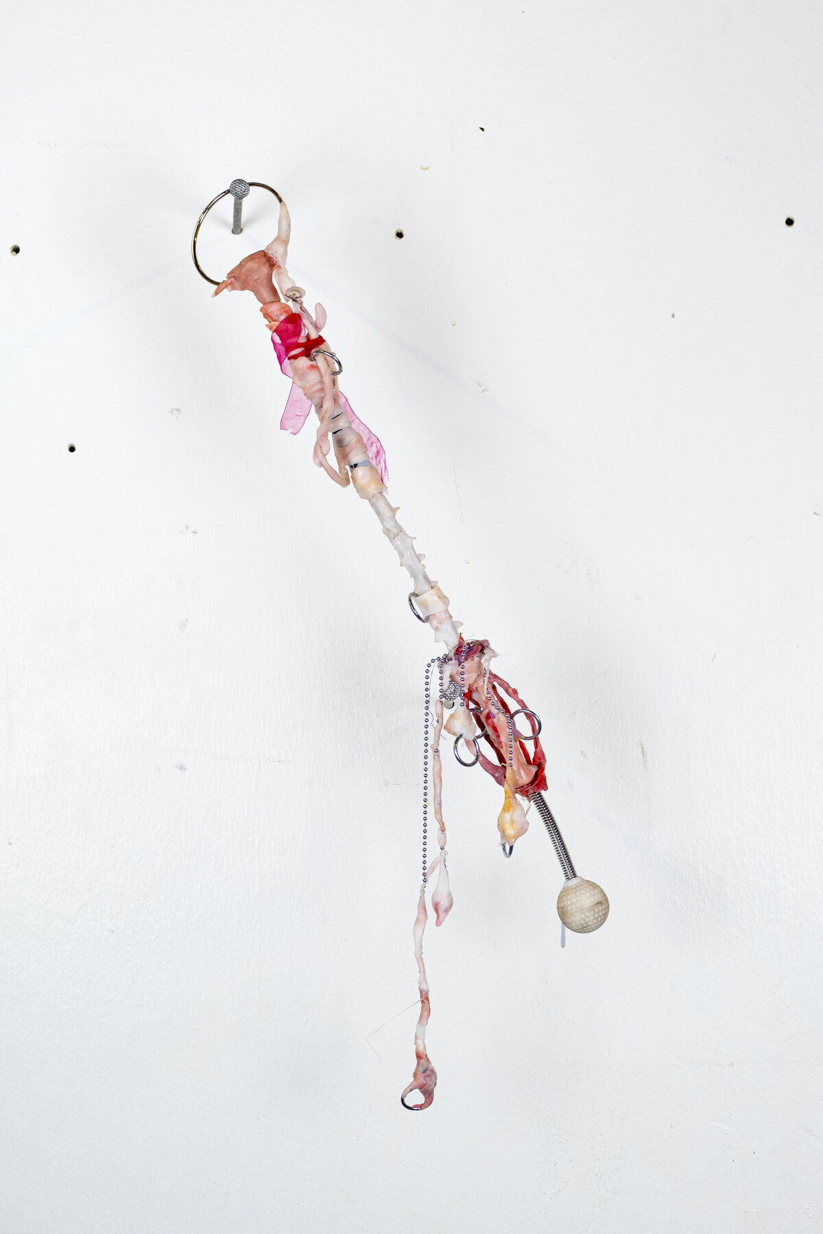 Post-apocalyptic weapon — 2022, plastic, chain, metal circle, back massager with ball, textile, 50×3×3 cm
